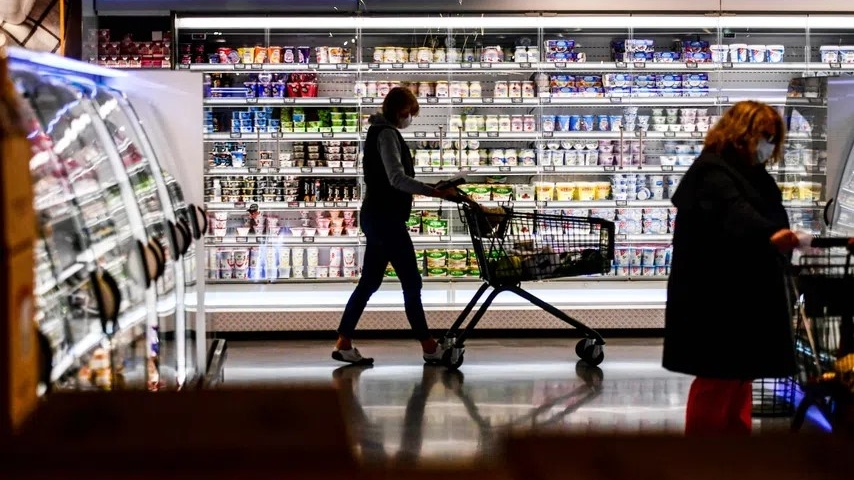 Shoppers browsing for grocery in a supermarket in Germany.
Image Source: The Business Times